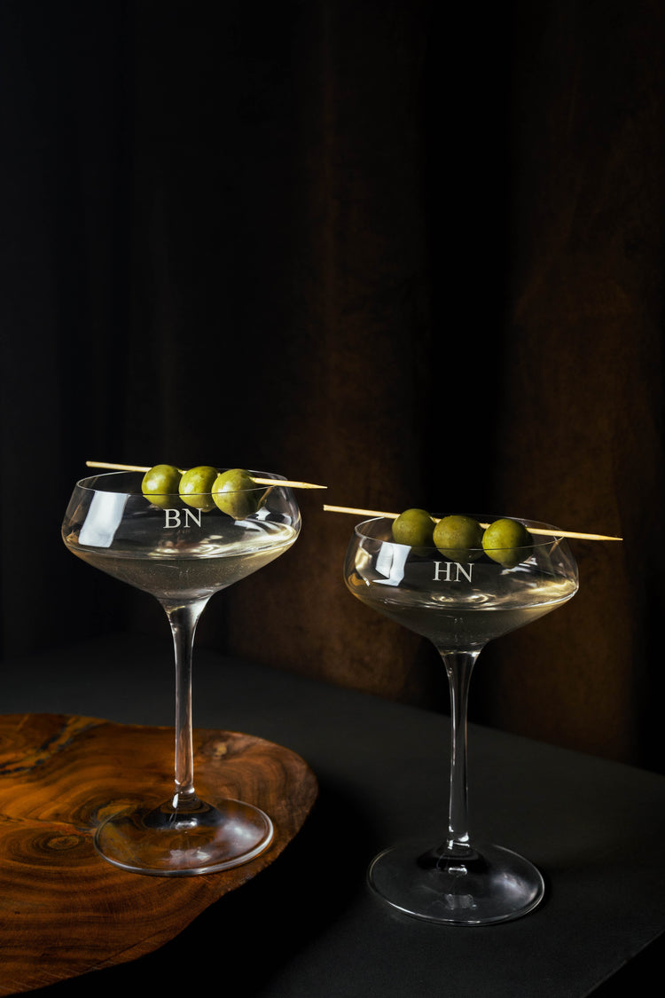 Set of two martini glasses that are engraved with initials